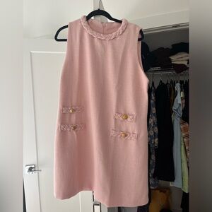 Pink dress with buttons. Never been worn before.